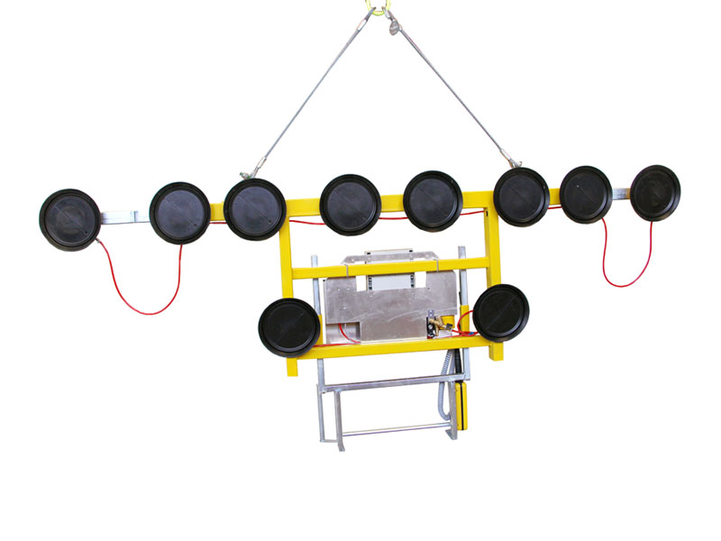 The Kombi 7011-AB-20 vacuum lifting device is intended for glass storage. The original single-row vacuum lifting device was extended with a guide handle and at least two suction cups suspended at a lower point. This means that plate materials measuring up to 6 metres in width can be moved around while suspended vertically.
